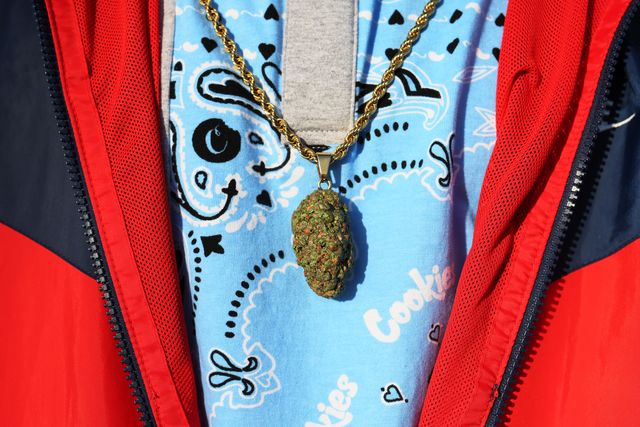An Apothecarium Dispensary employee wears a marijuana pendant on a chain on April 21st, 2022 in Maplewood, New Jersey.